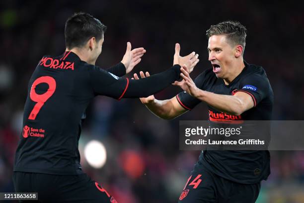 Marcos Llorente of Atletico Madrid celebrates with Alvaro Morata of Atletico Madrid after scoring his team's second goal during the UEFA Champions...