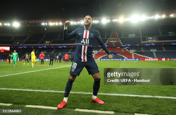In this handout image provided by UEFA, Neymar of Paris Saint-Germain celebrates victory after the UEFA Champions League round of 16 second leg match...