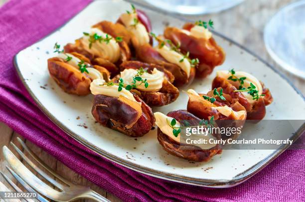 dates stuffed with processed cheese and thyme - date fruit stock pictures, royalty-free photos & images