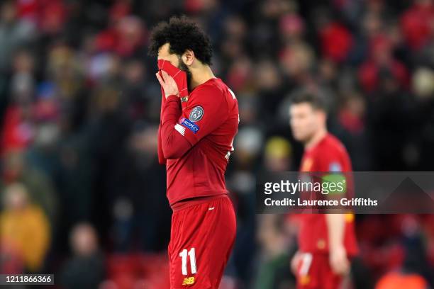 Mohamed Salah of Liverpool reacts to defeat after the UEFA Champions League round of 16 second leg match between Liverpool FC and Atletico Madrid at...