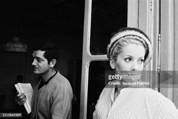 French actress Catherine Deneuve and director and screenwriter Jacques Demy on the set of Les Demoiselles de Rochefort. Demy directed the film with...