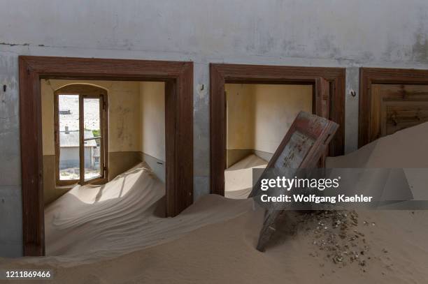 Sand slowly filling a building in the abandoned German diamond mining settlement of Kolmanskop near Luderitz, Namibia.