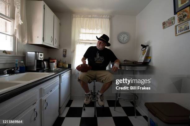 Former kicker Tom Dempsey holding football in his kitchen at home. New Orleans, LA 9/26/2012 CREDIT: Bill Frakes