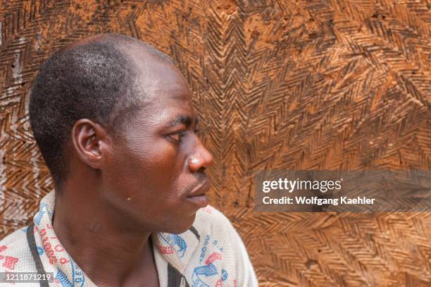 Portrait of a man in Somba Land, Benin, with scarification, which is applied on the face when they are children and is an initiation and entry into...