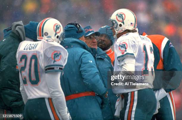 Playoffs: Miami Dolphins coach Don Shula with QB Dan Marino during game vs Buffalo Bills at Rich Stadium. Weather, snow. Orchard Park, NY 1/12/1991...