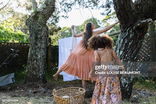 laundry with mum - peach color stock pictures, royalty-free photos & images