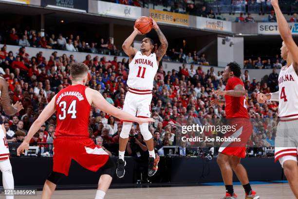 Devonte Green of the Indiana Hoosiers shoots the ball against the Nebraska Cornhuskers in the first half during the first round of the Big Ten Men's...