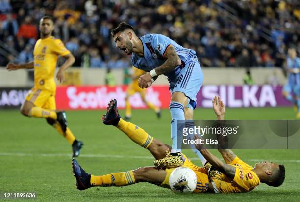 Valentin Castellanos of New York City FC and Francisco Meza of the UANL Tigres collide in the second half during Leg 1 of the quarterfinals during...