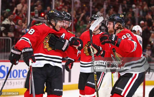 Patrick Kane of the Chicago Blackhawks celebrates his second goal of the game with Slater Koekkoek, Olli Maatta and Alex Nylander at the United...