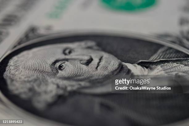 george washington's face on a us one dollar bill - american one dollar bill fotografías e imágenes de stock