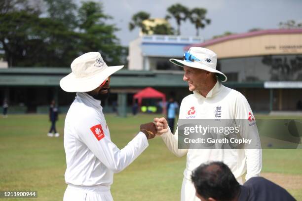 England captain Joe Root fist pumps SLC Board President's XI captain Lahiru Thirimanne ahead of the tour match between SLC Board President's XI and...