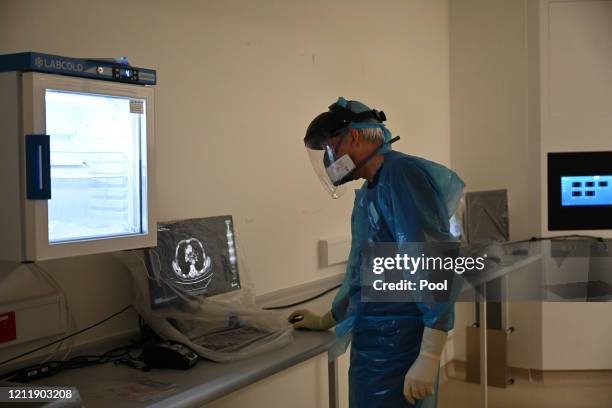Clinical staff wear Personal Protective Equipment as they care for a patient at the Bronchoscopy unit at Royal Papworth Hospital on May 5, 2020 in...