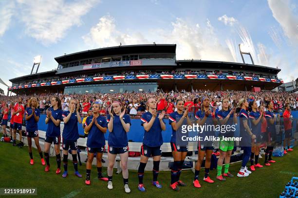 The United States women's soccer team clap after the singing of the national anthem before the SheBelieves Cup match against the Japan at Toyota...