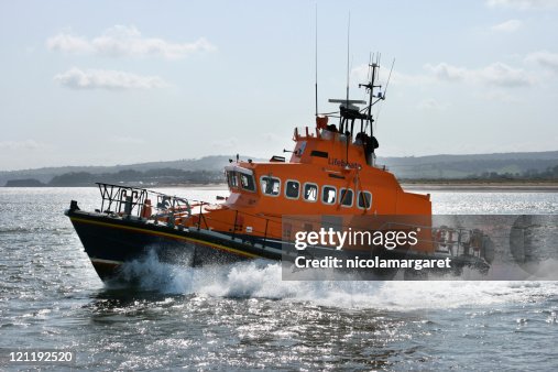 Coast guard boat moving quickly through the sea