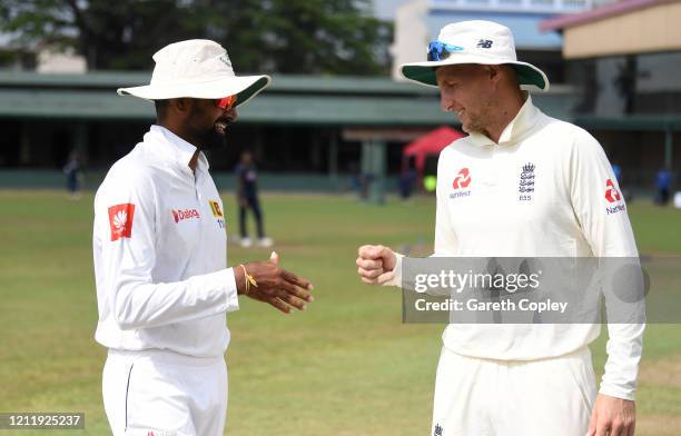 England captain Joe Root fist pumps SLC Board President's XI captain Lahiru Thirimanne ahead of the tour match between SLC Board President's XI and...
