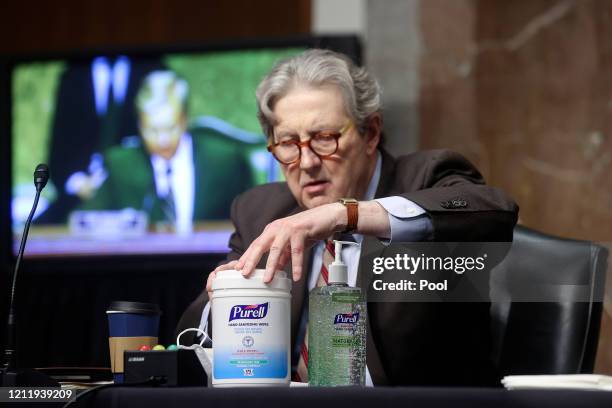 Senator John Kennedy uses hand sanitizer prior to a Senate Judiciary Committee hearing on the nomination of Judge Justin Reed Walker to be a U.S....