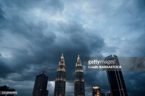 kuala lumpur view of the petronas towers, iconic symbol of kl kuala lumpur is the federal capital and most populous city in malaysia. - petronas towers stock-fotos und bilder