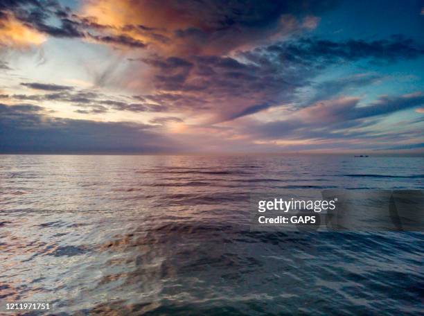 clouds over the north sea along the dutch coast near the hague just before sunset - the hague stock pictures, royalty-free photos & images