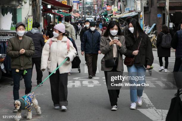 People shop in the Mangwon district on March 12 2020 in Seoul, South Korea. The South Korean government has raised the coronavirus alert to the...