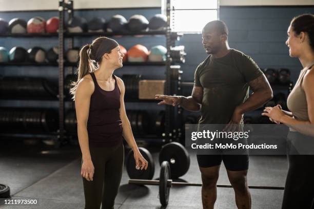 group of people hanging out after cross training class - 3 gym stock pictures, royalty-free photos & images