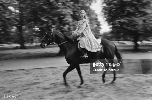 British actress Judi Bowker, one of the stars of London Weekend Television drama 'The Adventures of Black Beauty,' riding along Rotten Row in Hyde...