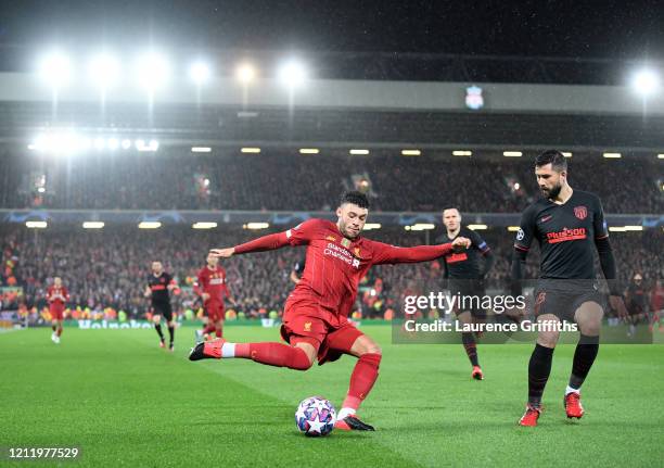 Alex Oxlade-Chamberlain of Liverpool crosses the ball during the UEFA Champions League round of 16 second leg match between Liverpool FC and Atletico...
