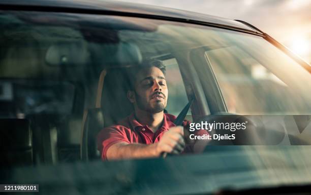 falling asleep while driving a car. - sleeping in car stock pictures, royalty-free photos & images