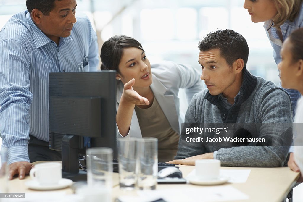 Young business woman presents ideas to her team