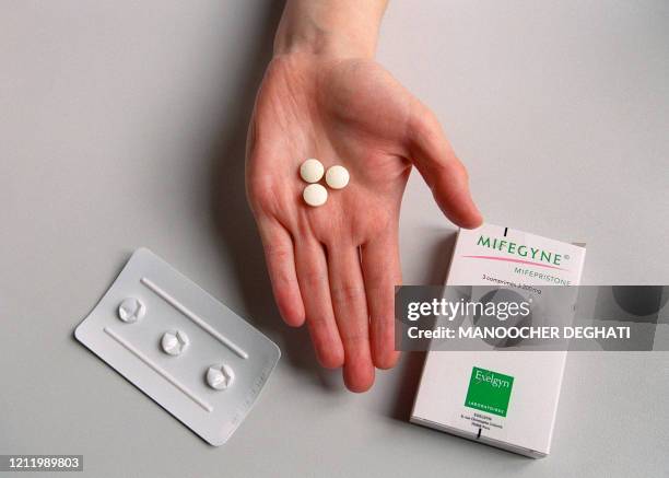 Nurse shows the RU486 pill at the family planning department of Hopital Broussais, 25 October 2000.