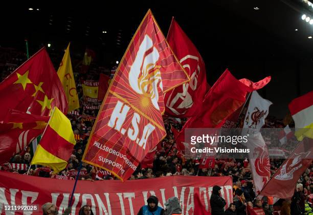 Liverpool flags being waved at the Kop End prior to the UEFA Champions League round of 16 second leg match between Liverpool FC and Atletico Madrid...