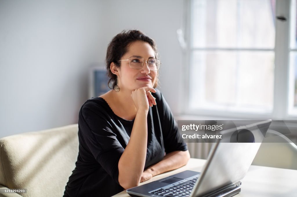 Businesswoman thinking while working in office