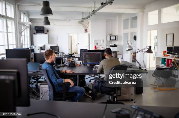 Computer Programmers Working On A New Project High-Res Stock Photo ...