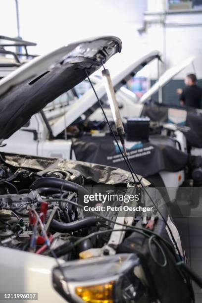 diesel technicians working on an engine. - car repair stock pictures, royalty-free photos & images