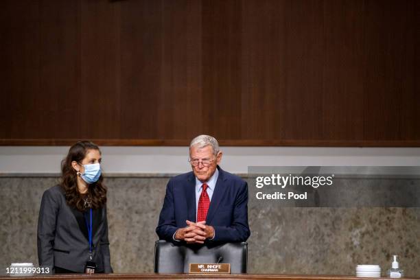 Senate Armed Services Committee Chairman James Inhofe talks with a staff member prior to the Senate Armed Services Committee hearing on the...