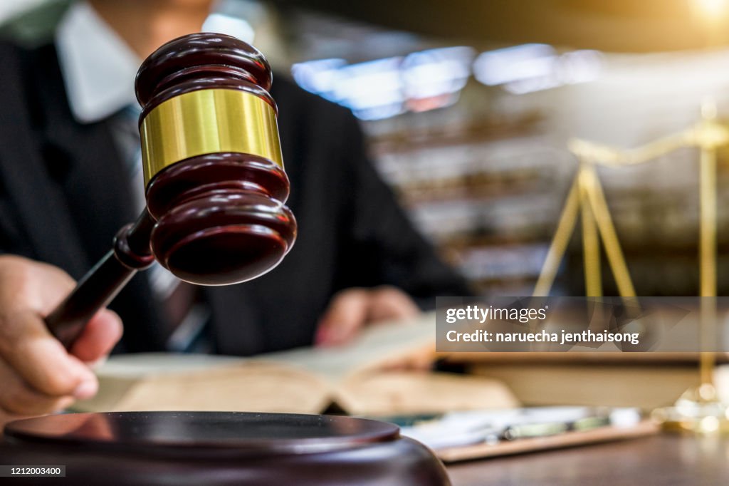 Close up of judge holding gavel