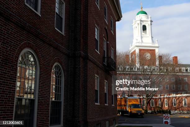 Moving truck sits in front of Eliot House on the campus of Harvard University on March 12, 2020 in Cambridge, Massachusetts. Students have been asked...