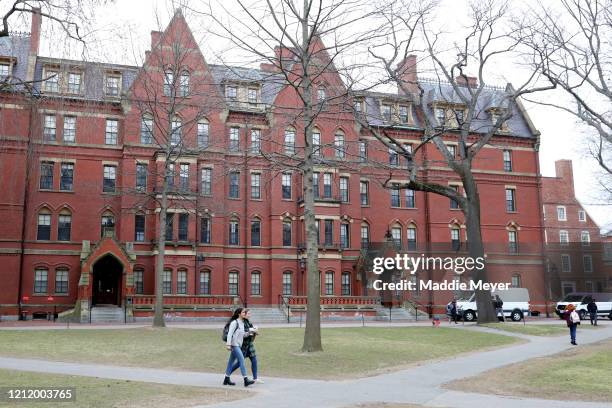 Students walk through Harvard Yard on the campus of Harvard University on March 12, 2020 in Cambridge, Massachusetts. Students have been asked to...