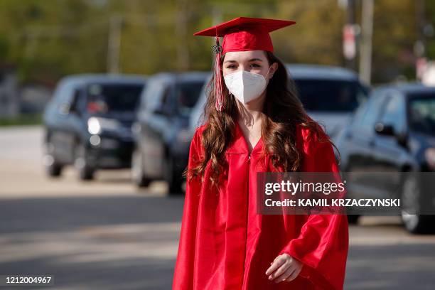 Graduate student arrives to pick her up diploma at Bradley-Bourbonnais Community High School on May 6, 2020 in Bradley, Illinois. - A speech by...