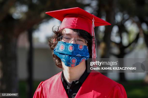 Graduate student arrives to pick up his diploma at Bradley-Bourbonnais Community High School on May 6, 2020 in Bradley, Illinois. - A speech by...