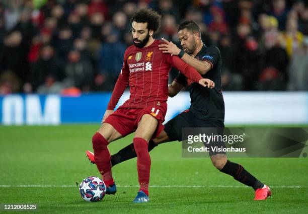 Mohamed Salah of Liverpool and Renan Lodi of Atletico Madrid during the UEFA Champions League round of 16 second leg match between Liverpool FC and...