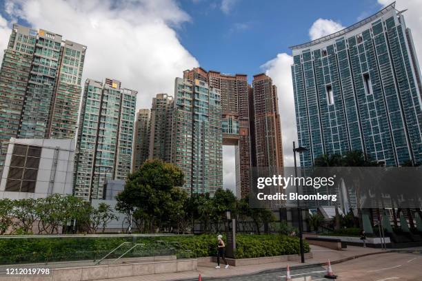Buildings stand at the Waterfront residential complex, developed by Wing Tai Properties Ltd., from left, the Arch residential complex, developed by...