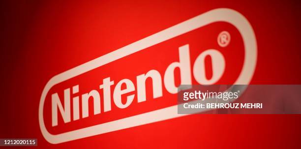 This picture taken on November 19, 2019 shows the logo of Japan's Nintendo Co. Displayed at a store during a press preview in Tokyo. - Nintendo was...