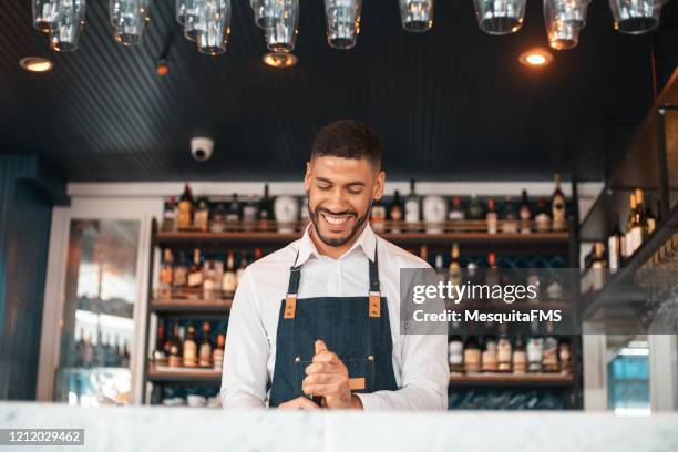 man opening wine bottle - bartender stock pictures, royalty-free photos & images