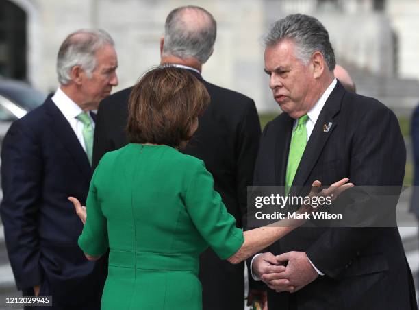 House Speaker Nancy Pelosi talks with Rep. Peter King after the annual Friends of Ireland luncheon at the Rayburn Room of U.S. Capitol March 12, 2020...