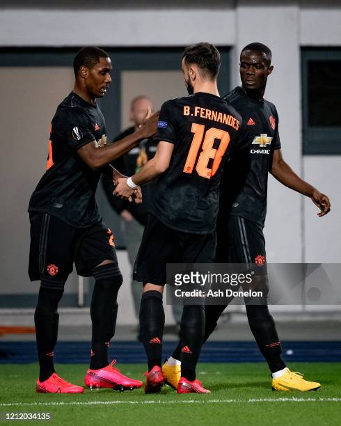 Odion Ighalo of Manchester United celebrates scoring their first goal during the UEFA Europa League round of 16 first leg match between LASK and...