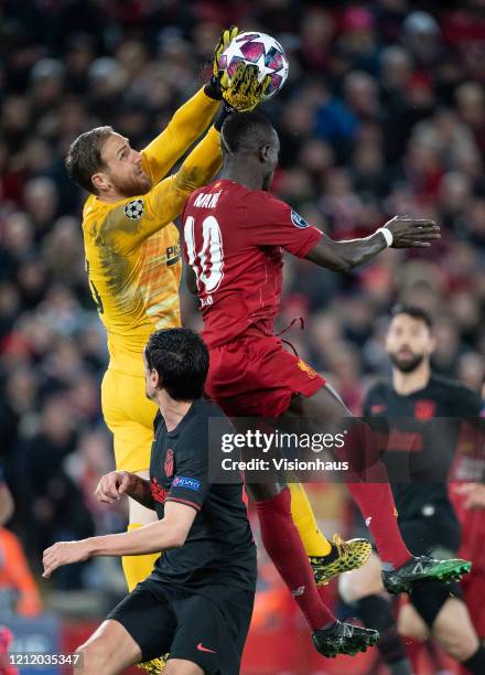 Sadio Mane of Liverpool and goalkeeper Jan Oblak of Atletico Madrid during the UEFA Champions League round of 16 second leg match between Liverpool...