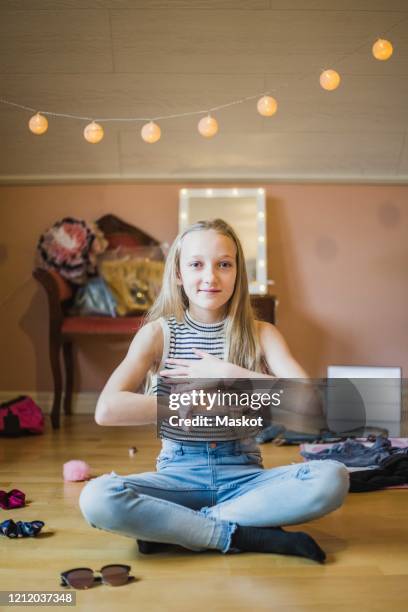 full length portrait of girl gesturing while sitting on floor in bedroom - youtube stock pictures, royalty-free photos & images