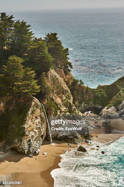 high view of big sur waterfall and ocean from highway 1 - monterey california stock pictures, royalty-free photos & images