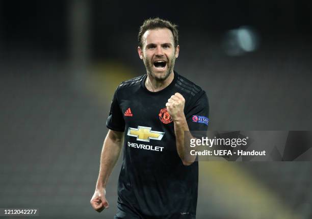 In this handout image provided by UEFA, Juan Mata of Manchester United celebrates after scoring his team's third goal during the UEFA Europa League...