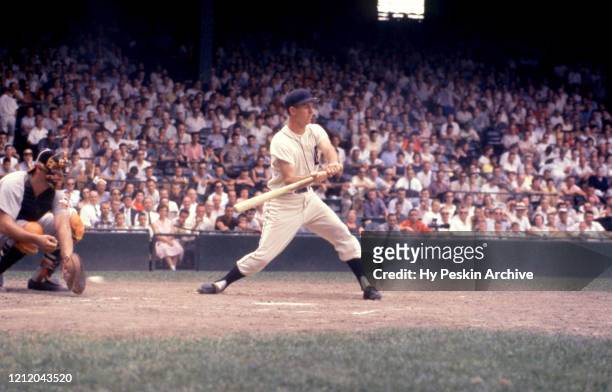 Al Kaline of the Detroit Tigers checks his swing during an MLB game against the Baltimore Orioles on June 28, 1959 at Briggs Stadium in Detroit,...